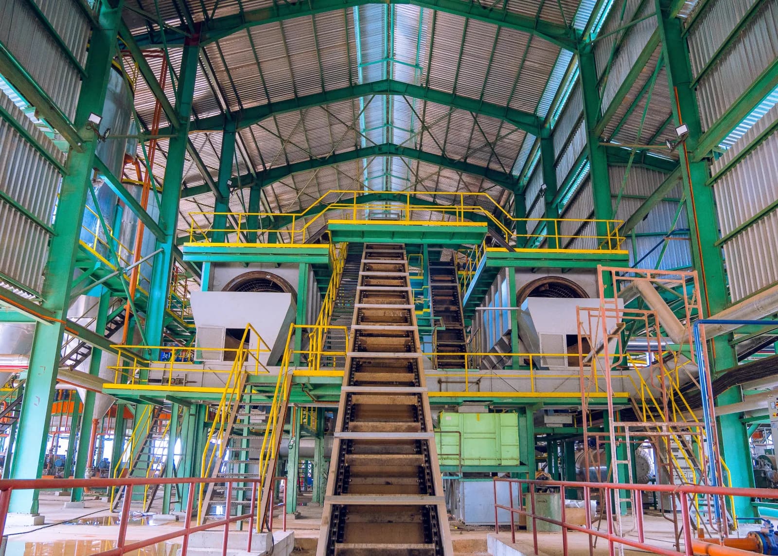 Mill processing tanks and piping under construction
