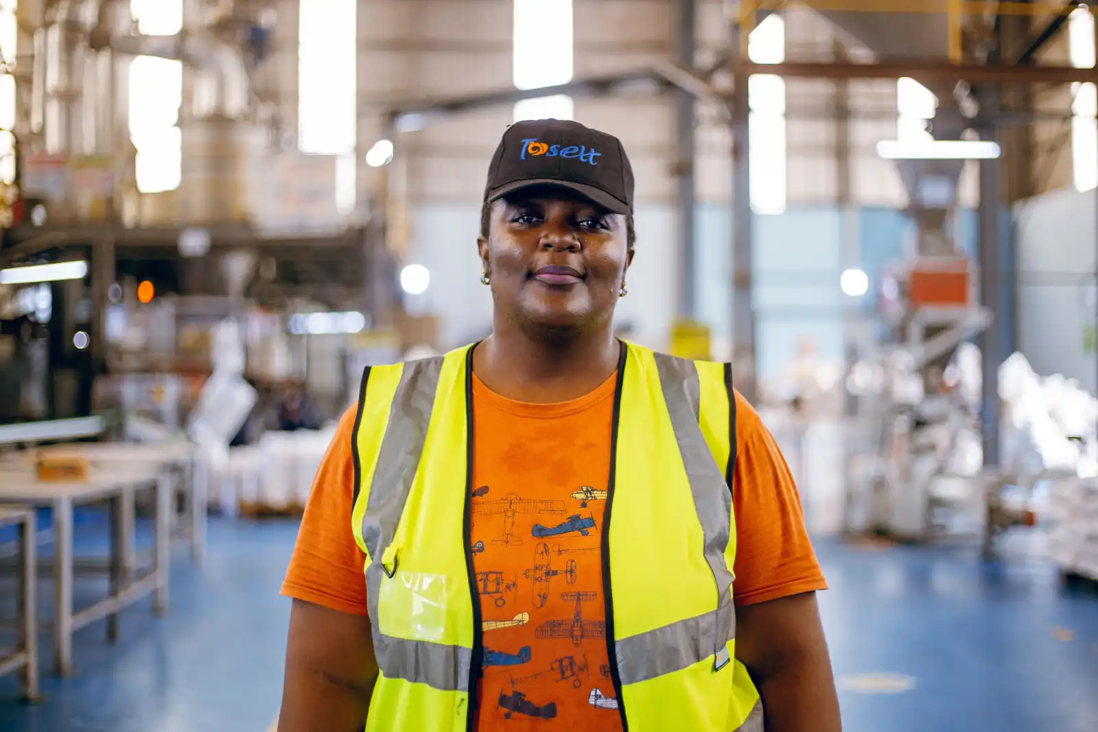Worker in high-visibility vest at plantation